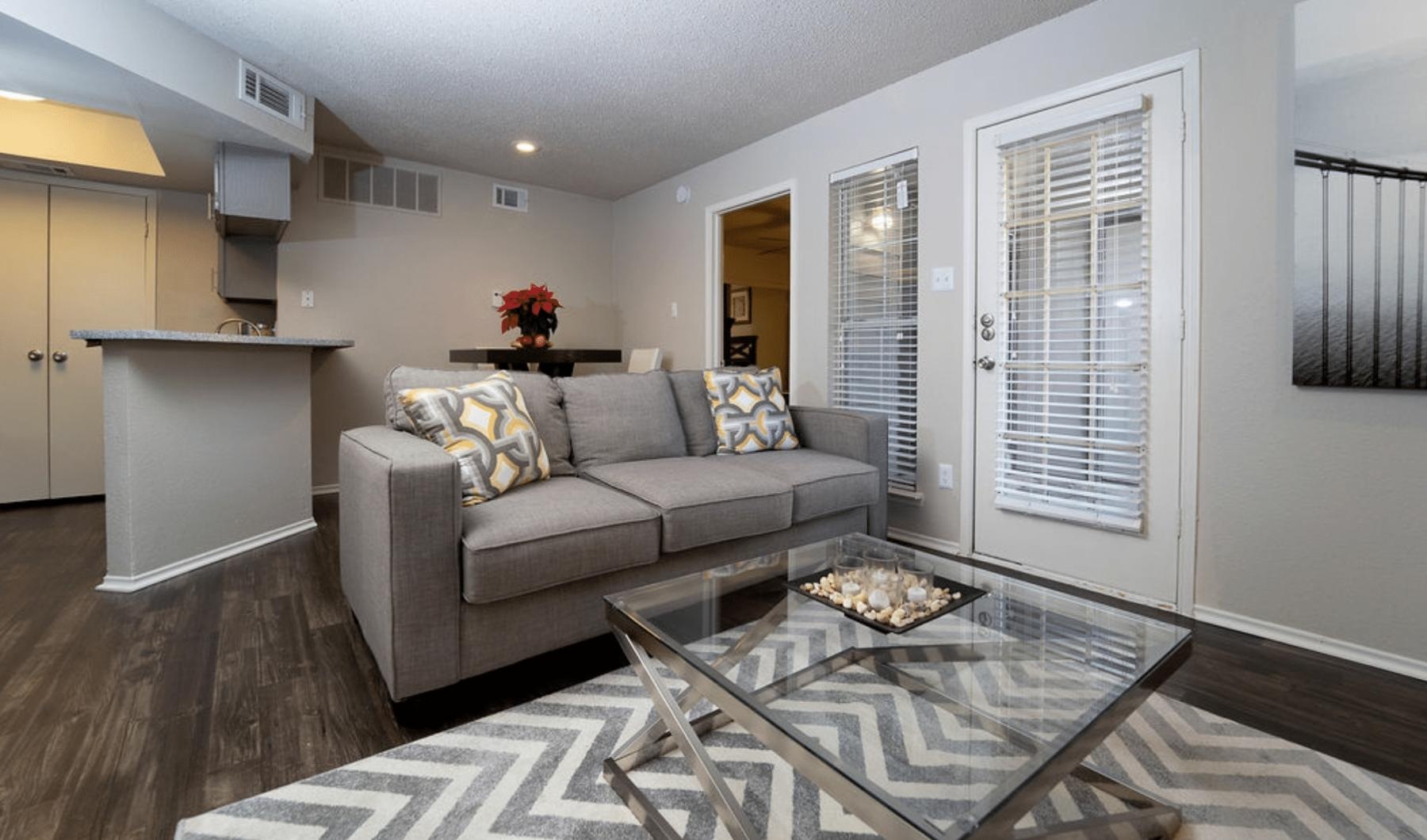 Bedroom options to fit every lifestyle a living room with a couch and a coffee table