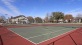 a tennis court with a red and white striped court